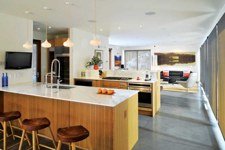 The kitchen cabinetry is made from recycled pine.